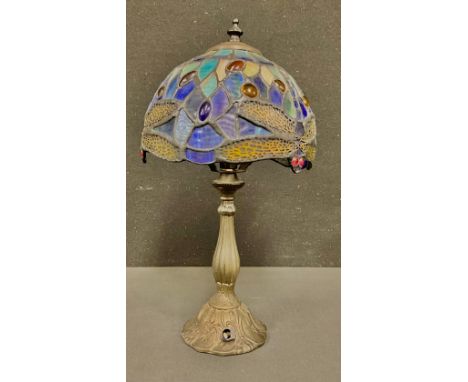 A contemporary Tiffany style leaded glass table lamp, the shade in tones of blue, with stylised dragonflies, the base moulded