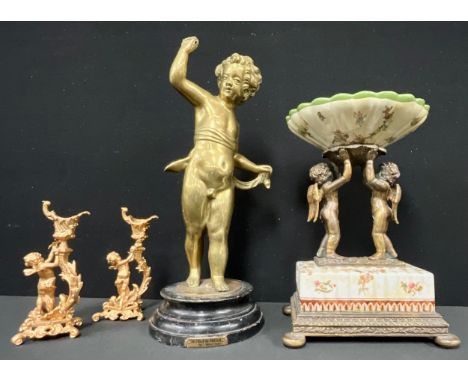 A 20th century Wong Lee porcelain and bronze figural table centre, modelled as two cherubs supporting a shaped circular dish,