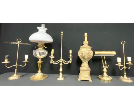 A Victorian/Edwardian oil lamp, clear glass font, cut with stars, brass support with spreading circular base, opaque glass sh