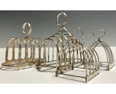 A George V silver four division toast rack, James Dixon &amp; Sons, Sheffield 1935, 103g ; three others silver plated (4)