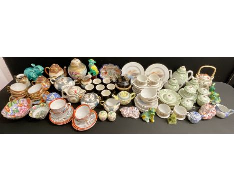 Oriental - a Japanese Noritake three piece tea service; a Japanese eggshell part tea service, decorated with blossoming prunu