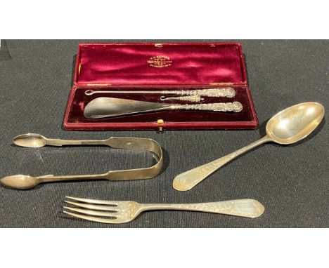 A Victorian silver fork and spoon, London 1879; Victorian silver sugar bows, Edinburgh 1843; a button hook and shoehorn set, 
