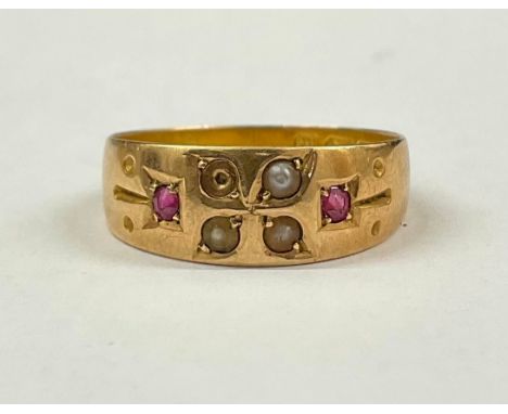 Antique 15ct gold ruby and seed pearl ring (A/F)The ring is set with three seed pearls and two melee old cut pink rubies, the