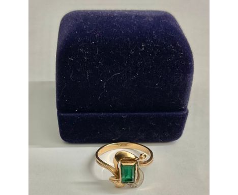 Russian 14ct Rose Gold Synthetic Emerald and Diamond RingThe ring is set with a rectangular step cut Emerald that measures ap