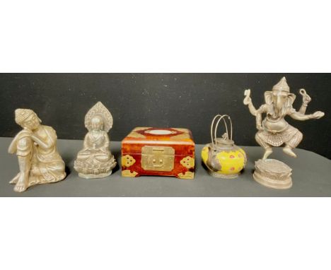 A silver coloured metal figure, Ganesha, 19cm high; a silver coloured metal figure, Guanyin, seated on a lotus, 14cm high; an