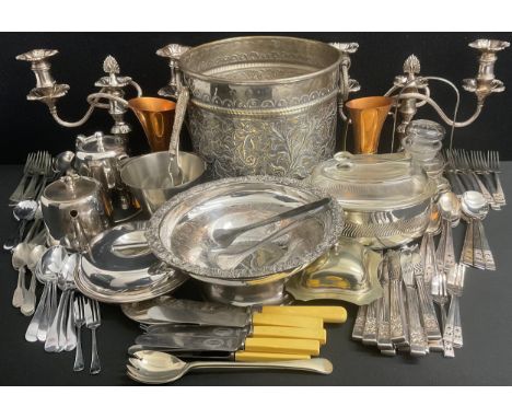 A pair of silver plated two branch candelabra;  large brass silver plated planter,  teapots, muffin dish, community plate can