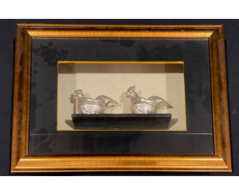 A pair of Burmese silver plated figurines, cast as hens, cased for display, 43cm x 59cm