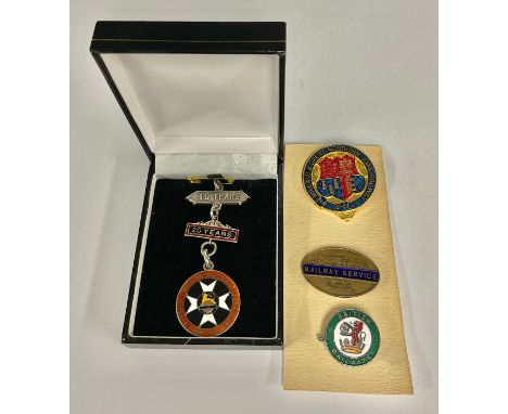 A British Railways 20 and 30 year First Aid hallmarked silver medal; a LMS  Railway Service badge; two enamel Railway badges