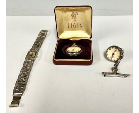 A George V silver and magnification glass globular nurses suspension watch, manual wind movement, ribbon pin brooch mount, Ch