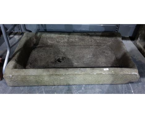 A large antique stone trough 104 x 67 cms