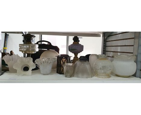 Victorian brass, clear and black glass oil lamp with cut glass well, gilt metal and purple opaque glass oil lamp and various 