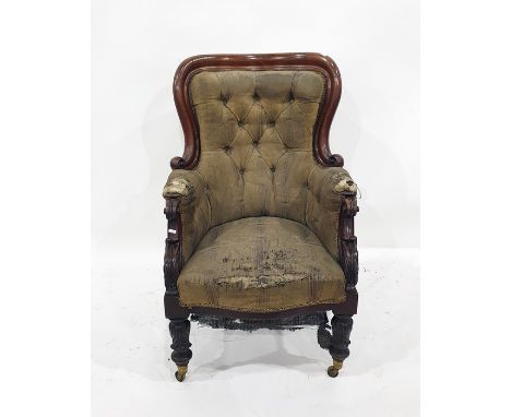 19th century walnut-framed armchair with upholstered button back, serpentine front seat, heavy carving to the arms and legs, 