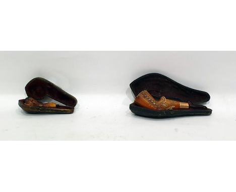 Novelty meerschaum amber pipe in the form of a lady's leg and another smaller claw-patterned pipe, both cased (2) 