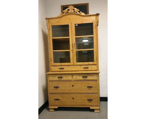 20th century pine dresser cabinet with arched top above two glazed doors, enclosing shelves, above single long drawer, raised