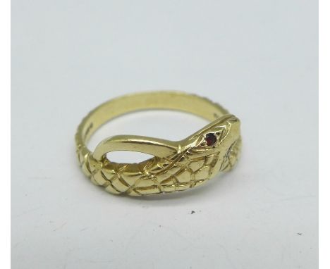 A 9ct gold snake ring with ruby set eyes, 2.7g, O