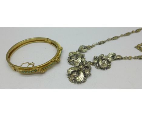 A Victorian plated bangle set with turquoise and seed pearl and a paste set necklace