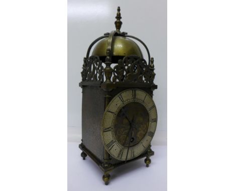 A lantern clock marked Astral, Coventry on back plate