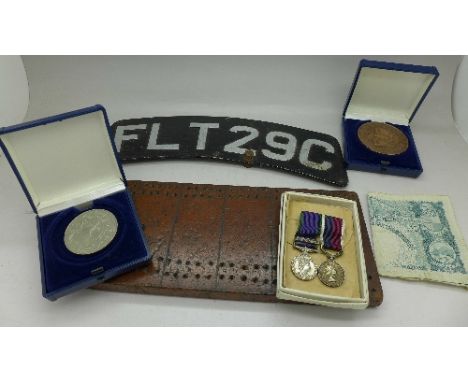 A pair of miniature medals including one with Northern Ireland bar, two commemorative coins, a banknote, a motorcycle number 