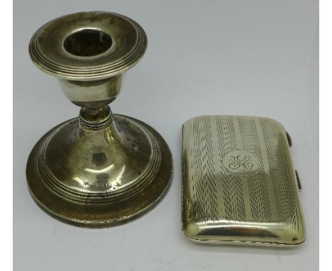 A silver candlestick and a silver cigarette case, weight of case 62g