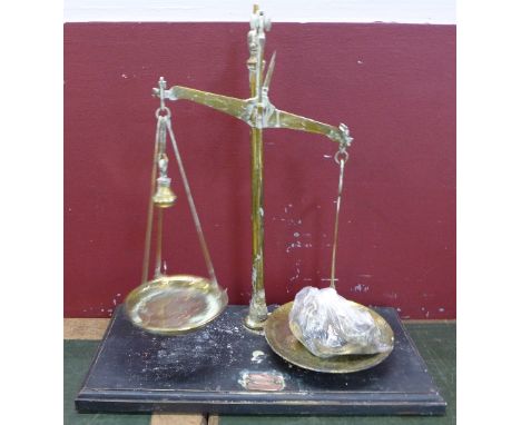 A set of balance scales with weights