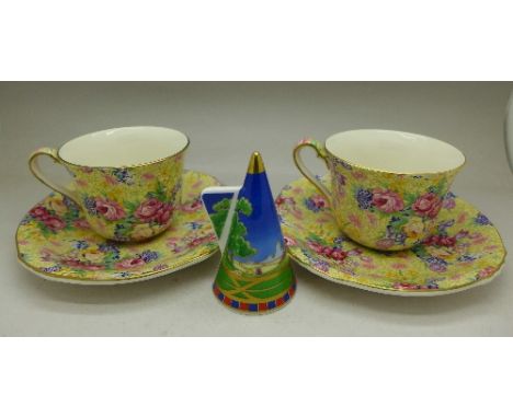 Two Royal Winton Welbeck chintz cups and saucers and a Royal Worcester Lazy Days commemorative candle snuff