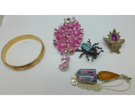 A silver necklet, two insect brooches, a bangle and a large pendant/brooch