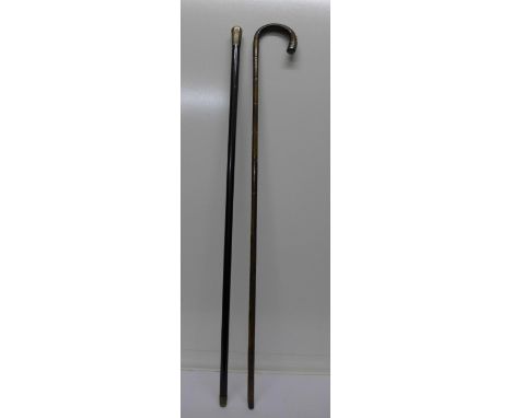 A silver top cane and walking stick with silver mount