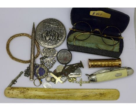 A pocket knife, a mirror, a shoe horn, etc.