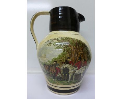 A large jug decorated with hunting scenes, marked Tranquiline on base, 33cm