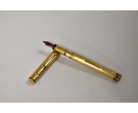 A Mabie Todd &amp; Co Swan leverfill fountain pen gold overlaid engine turned wavy Art Deco pattern having Swan 2 nib. In poo
