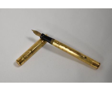 A Mabie Todd &amp; Co Swan leverfill fountain pen gold overlaid engine turned wavy Art Deco pattern having Swan 2 nib. In goo