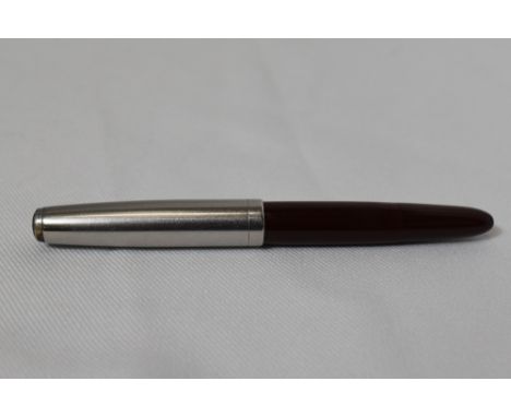 A Parker 51 demi button fill fountain pen in burgundy with lustraloy cap. In good condition