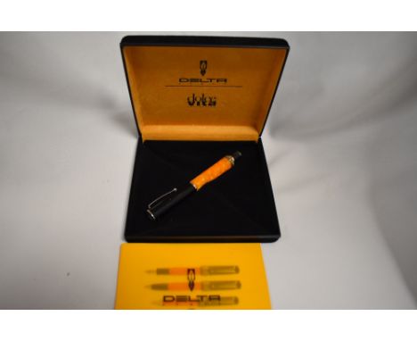 A boxed Delta Dolcevita rollerball pen in orange maarble and black and silver trim. As new condition with leaflet