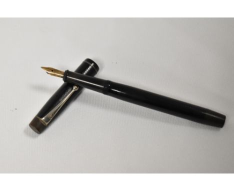 A De La Rue Onoto the pen plunger fill fountain pen in black with engine turn design having De La Rue Onoto nib. In good cond