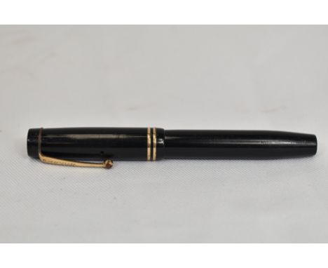 A Parker Duofold Jr Streamlined button fill in black with two bands to the cap having Parker DuofoldN nib. In good condition