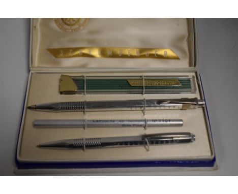 A Schlunberger ballpoint pen and mechanical pencil set, metal with refill leads and ink. Boxed, very good condition box a lit