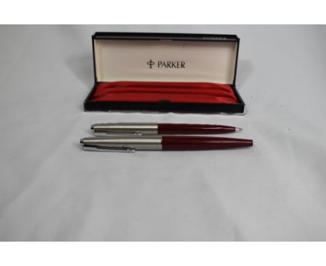 A Parker 45 fountain pen and ballpoint pen set in red in original box