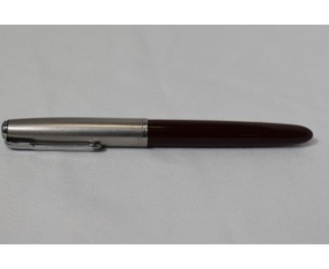 A Parker 51 button fill fountain pen in burgundy with lustraloy cap. In good condition