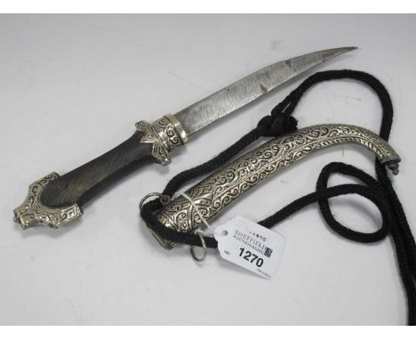 Middle Eastern Ceremonial Dagger with Wooden Handle, silvered mounts, and curved end to the scabbard, 30cm over length.