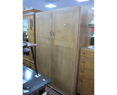 Ercol Two Door Wardrobe, with four internal small drawers on castors, 122cm wide.  FEW VERY SMALL MARKS MAINLY AROUND HANDLES