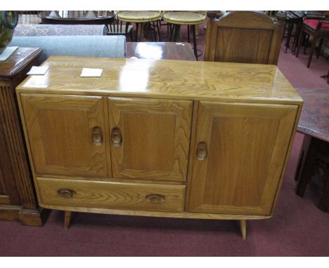 Ercol Golden Beech &amp; Elm Sideboard, with two cupboard doors over single drawer, with larger door to the right, on splayed