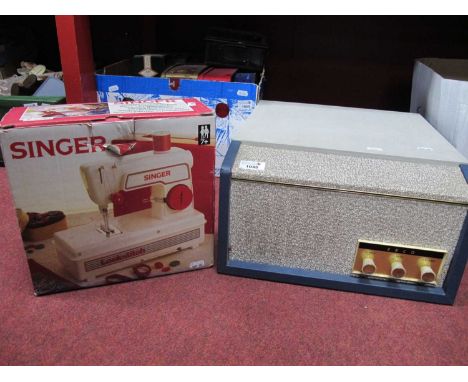 A Garrard portable record player together with a children's Singer Lockstitch sewing machine. (2)