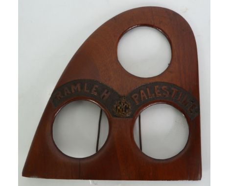 AN EARLY 20TH CENTURY TRIPLE PHOTOGRAPH FRAME formed from the end of a wooden propeller blade applied with Royal Flying Corpe