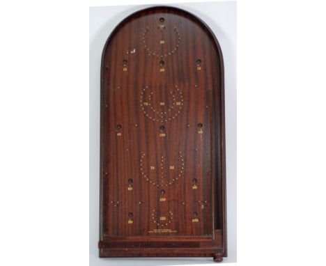 A BAGATELLE BOARD from the House of Marbles, Bovey Tracey, Devon 
