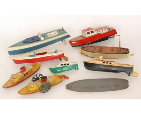A Wells Brimtoy paddle steamer with single funnel, yellow and red lithographed deck, length 26cm and Hornby two tone speedboa