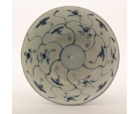 An early 19th Century Chinese Tek Sing Cargo bowl in underglaze blue and white with a repeat foliate scroll design, retains o