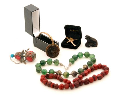 A carved wooden netsuke of a dog and puppy, a hardstone pendant of hotei with attendants, a plated bangle and crucifix, a sce