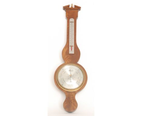 A 20th Century aneroid barometer, silvered register marked Comitti, London below conforming thermometer, length 75cm. 