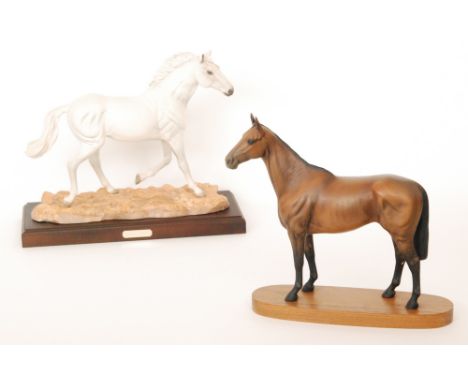 A Beswick model of Arkle Champion Steeplechaser, raised to a wooden plinth, height 30cm, S/D, together with a Royal Doulton m