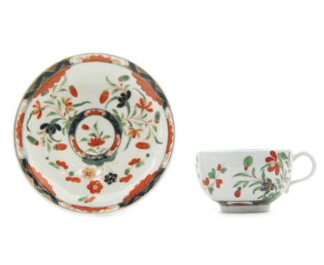 A late 18th Century Worcester coffee cup and saucer decorated in the Kempthorn pattern, fret mark to the base of the saucer, 
